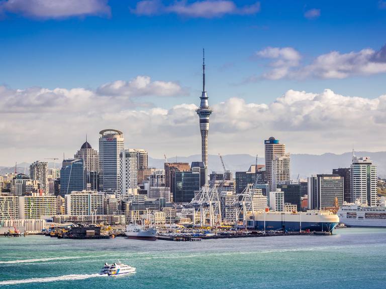 Auckland skyline at sunset, showcasing the city's vibrant skyline and iconic landmarks